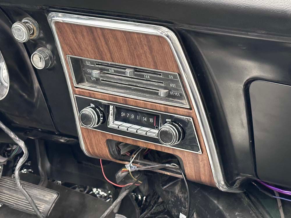 A close up of a car dashboard with a radio.