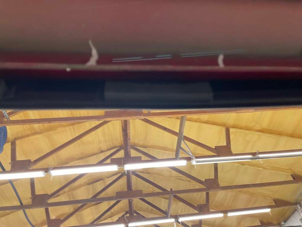 A ceiling with a lot of lights hanging from it