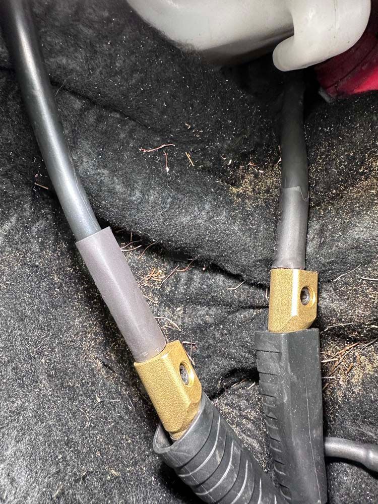 A close up of a pair of wires connected to each other.