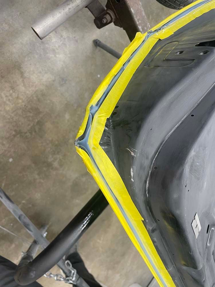 A close up of a car with yellow tape on it