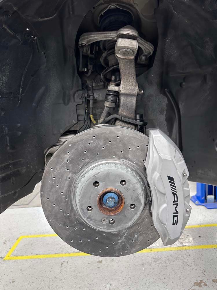 A close up of a brake disc on a car.