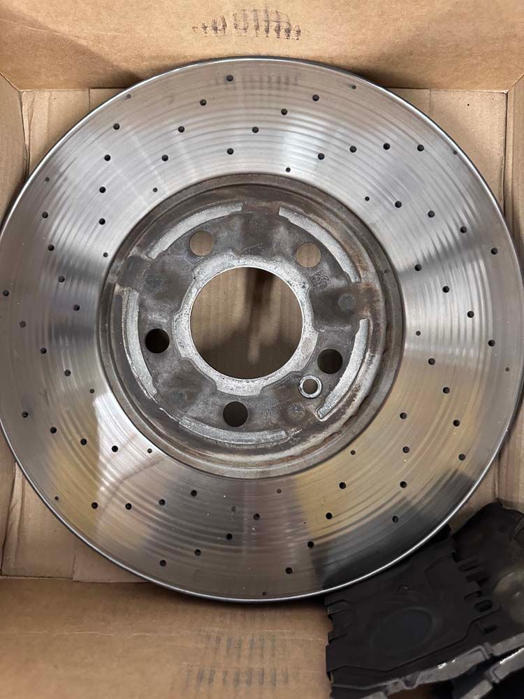 A close up of a brake disc in a box