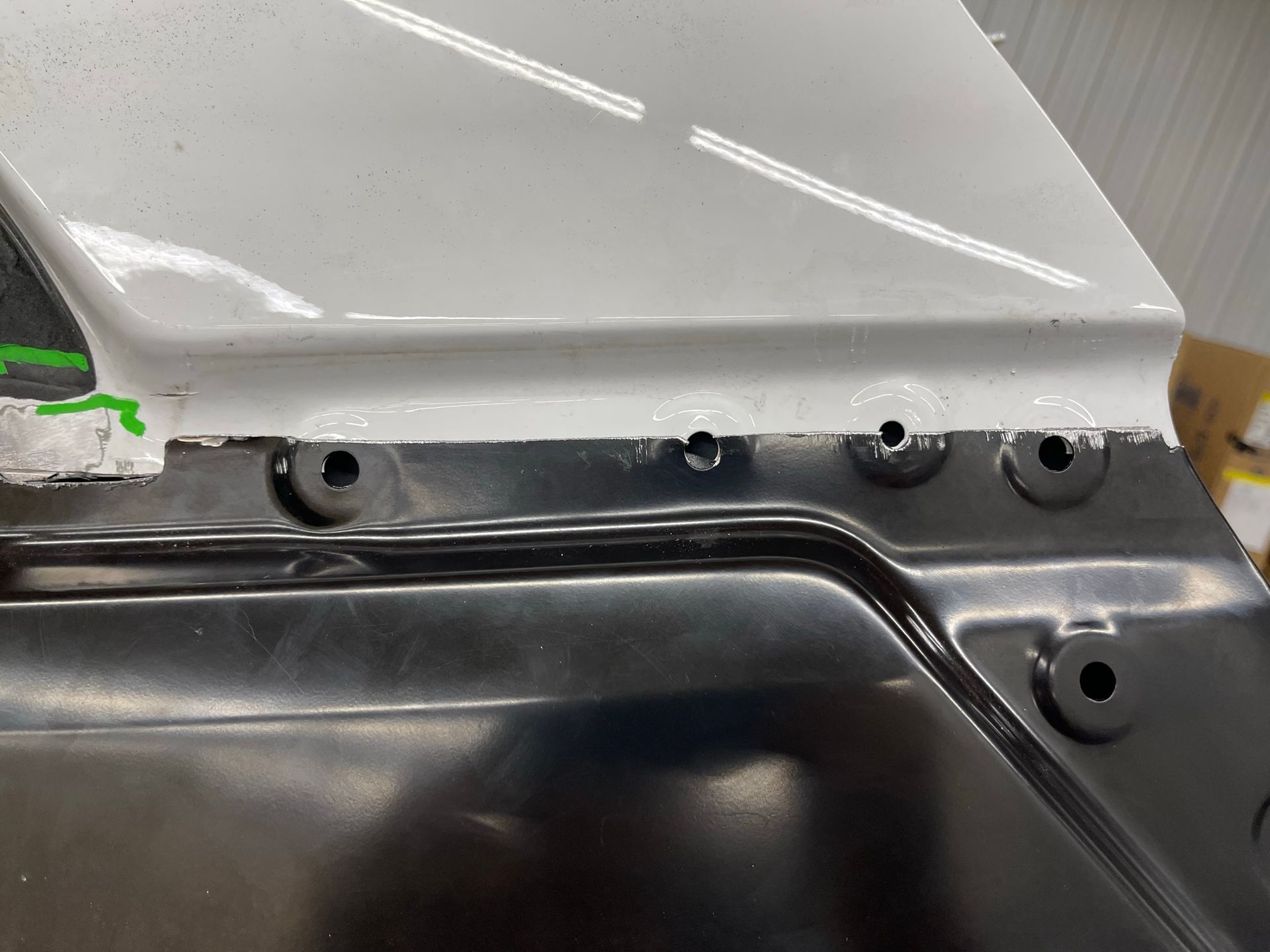 A close up of a piece of metal with holes in it.