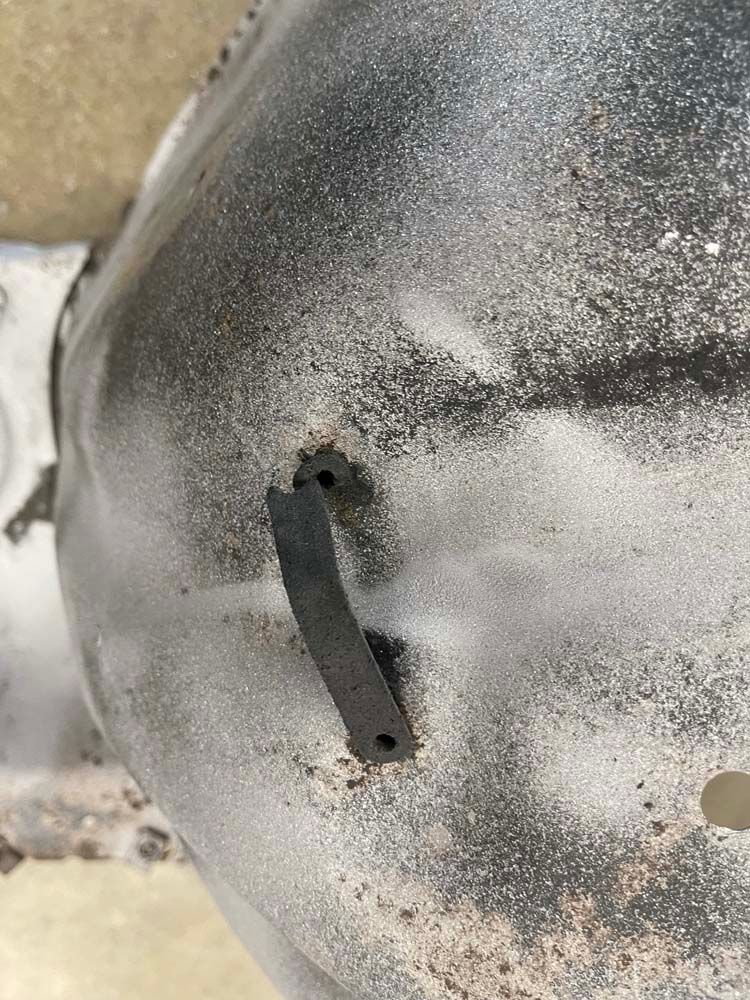 A close up of a metal object with a hole in it.