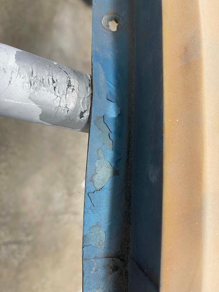 A close up of a piece of metal with a hole in it.