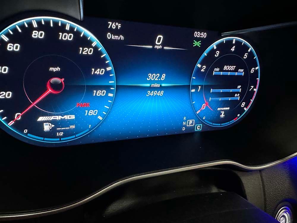A close up of a car dashboard with a speedometer and a tachometer