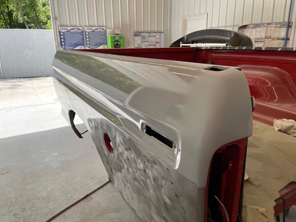 A red truck with a white bumper on it