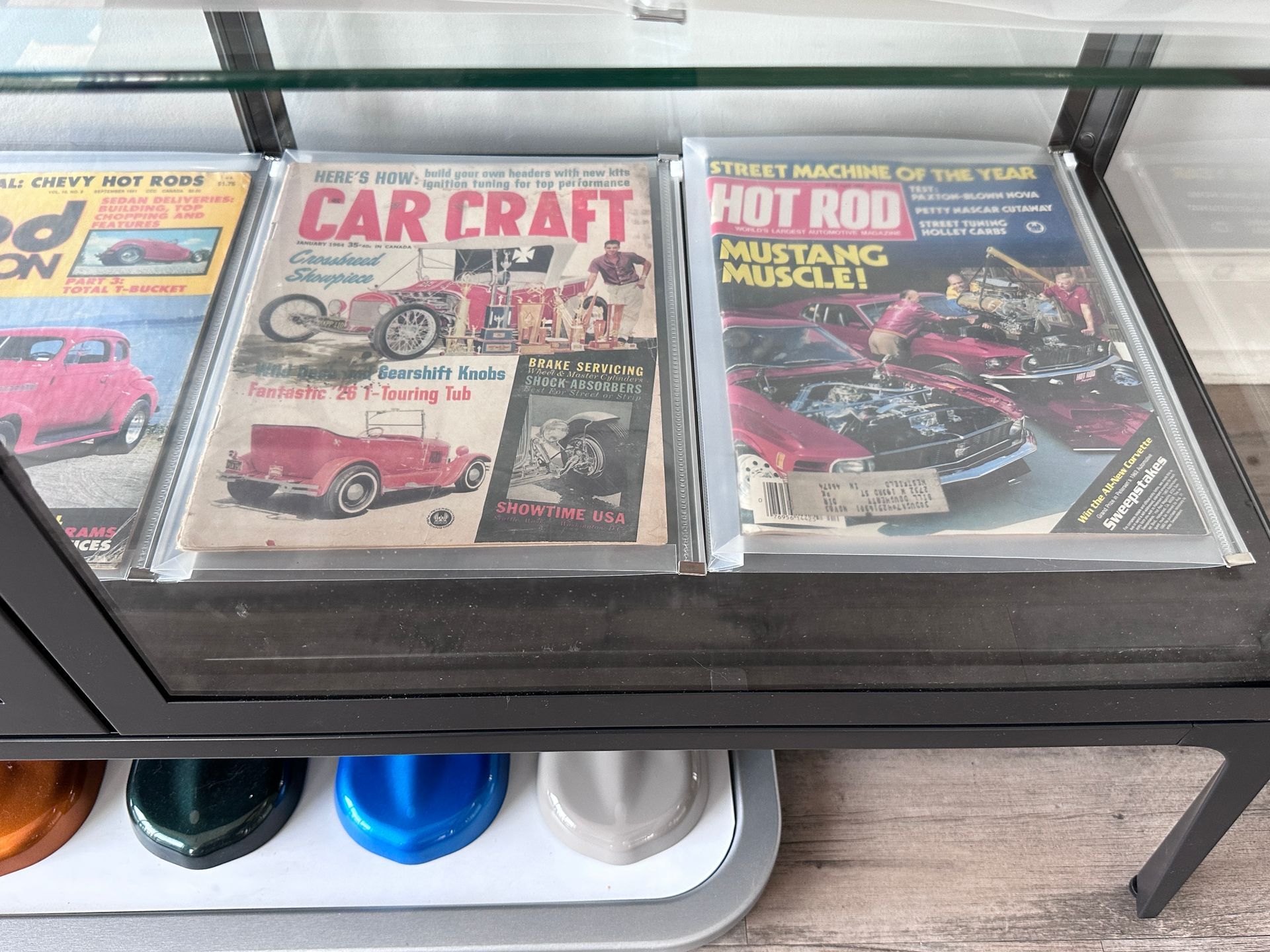 Three magazines on a table including car craft and hot rod mustang muscle