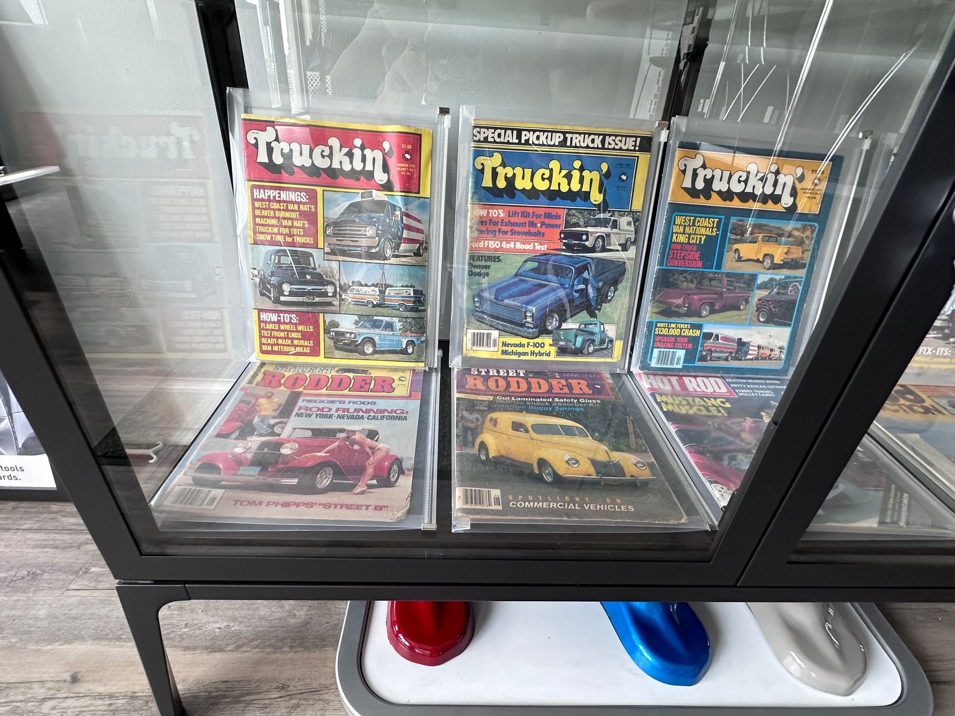 A display case filled with magazines including truckin '