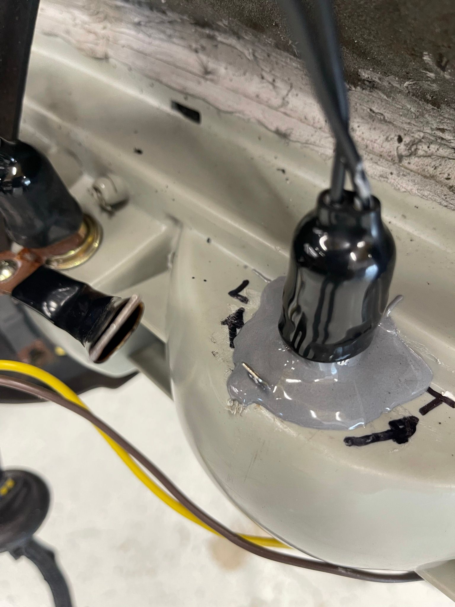 A close up of a light bulb sitting on top of a white surface.