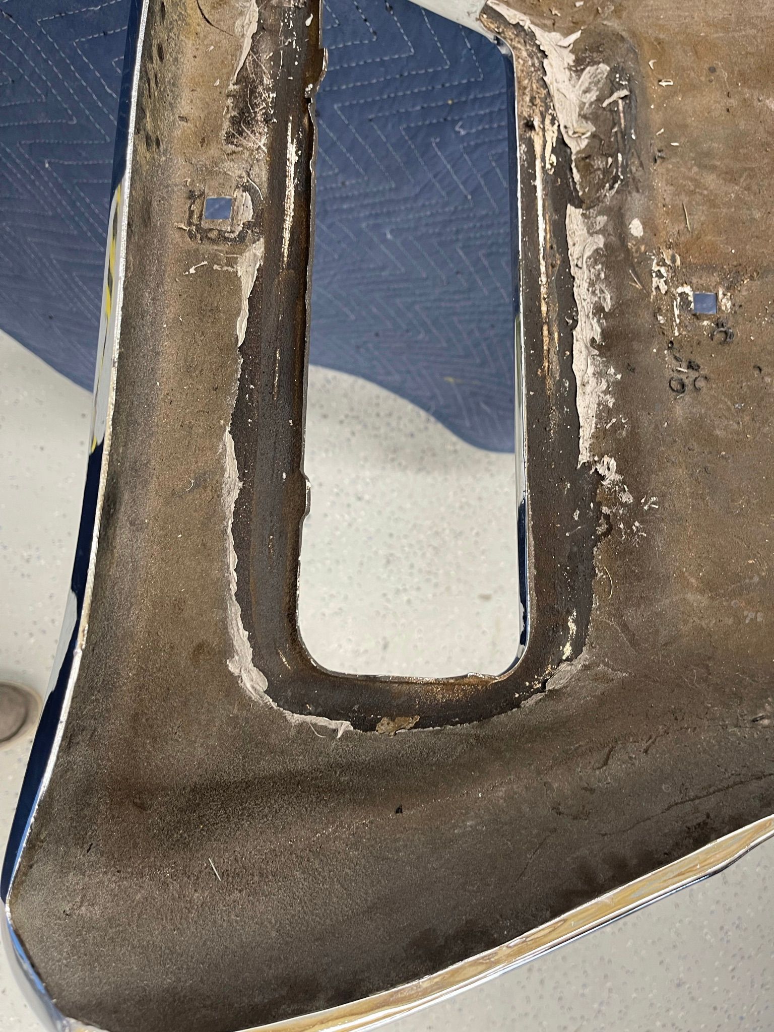 A close up of a piece of metal with a hole in it