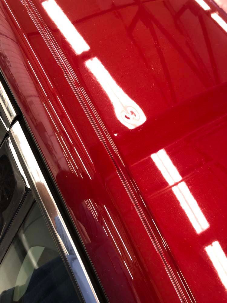 A close up of the roof of a red car