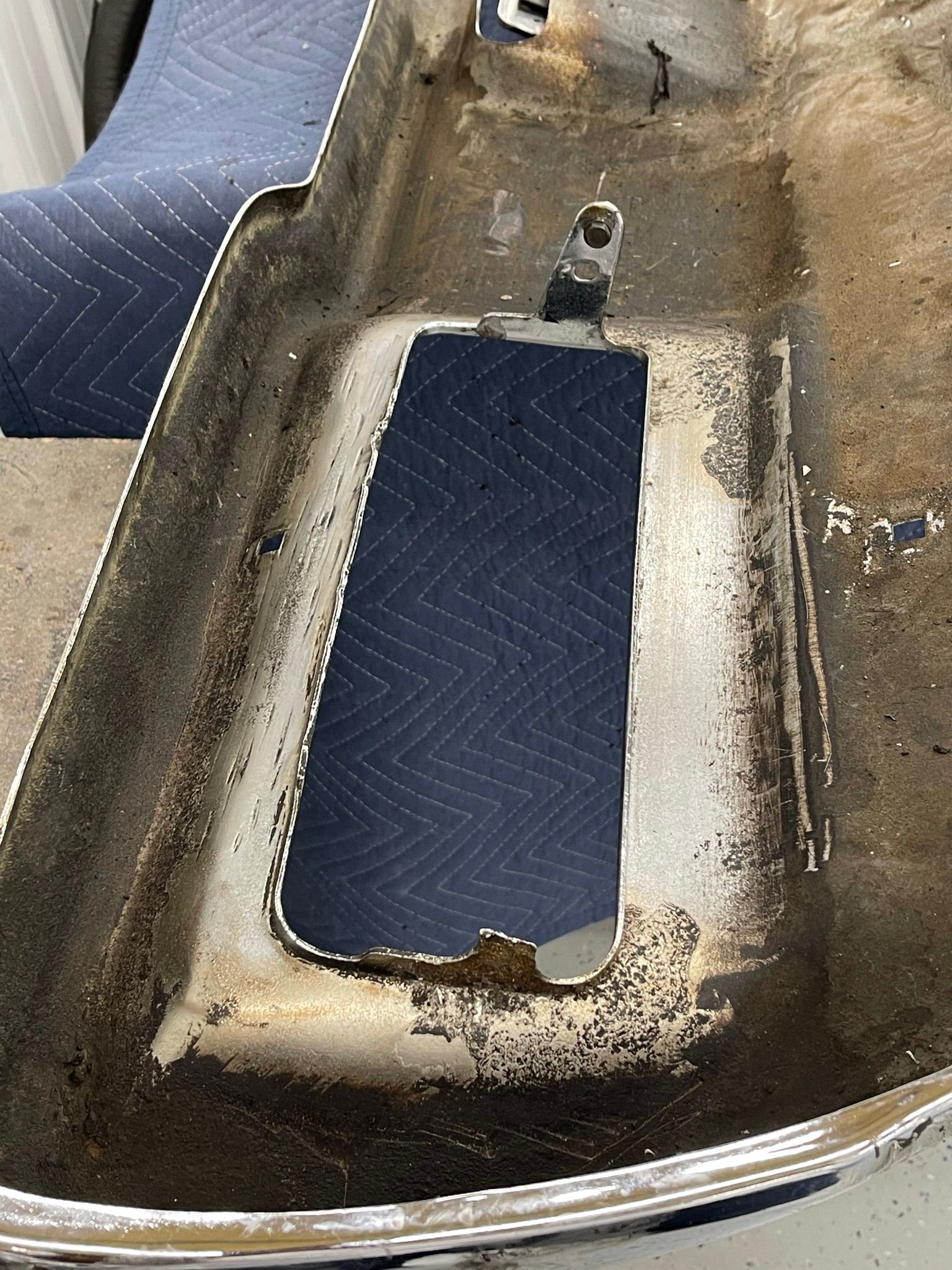 A close up of a piece of metal with a hole in it.