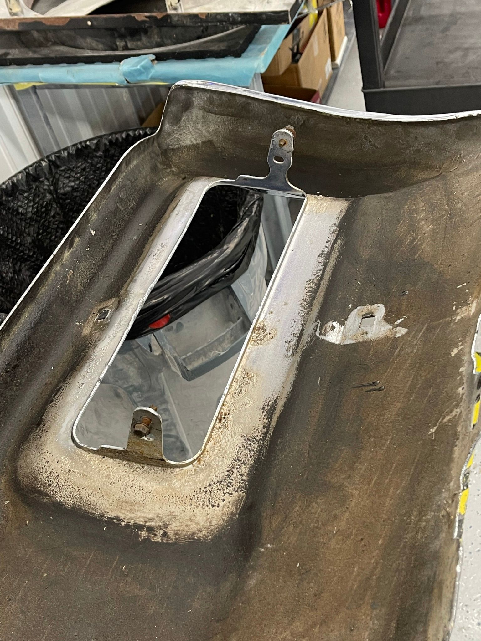 A close up of a piece of metal with a hole in it.