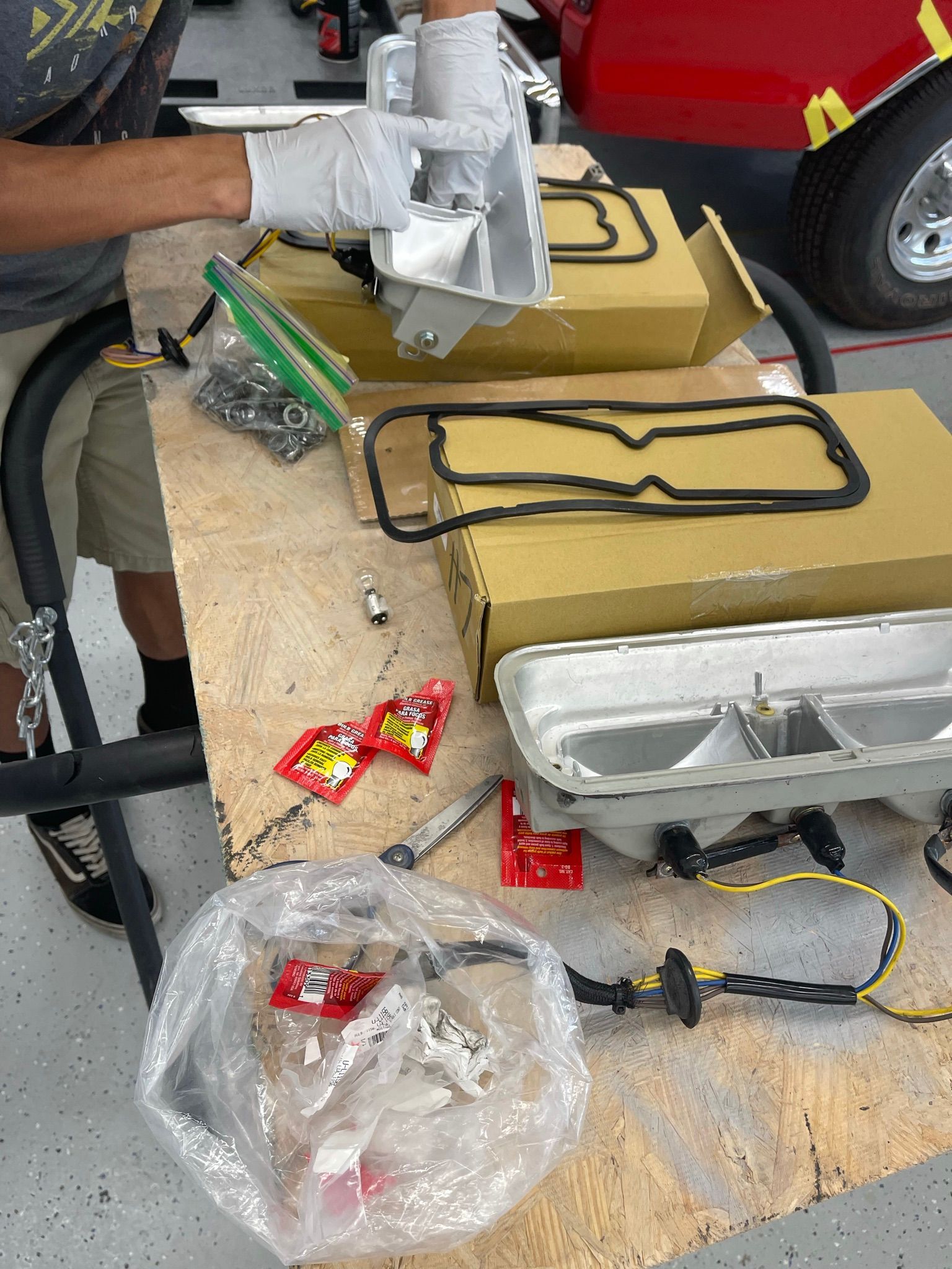 A man is working on a piece of equipment on a table.