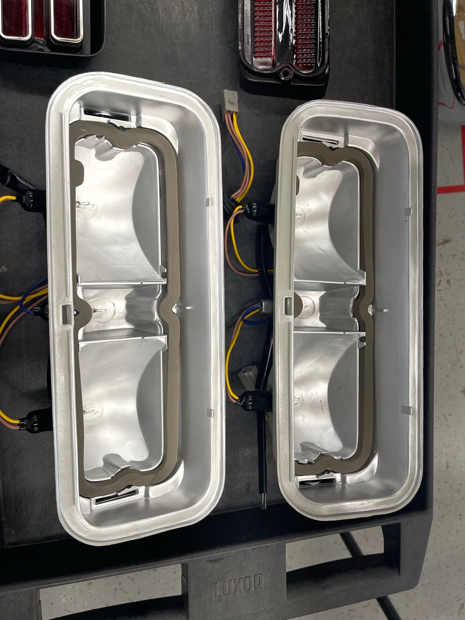 A pair of lights are sitting on top of a pallet.