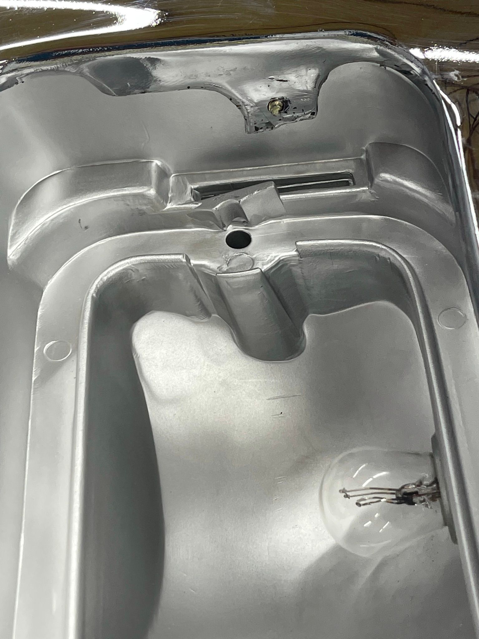 A close up of a metal object with a hole in the middle.