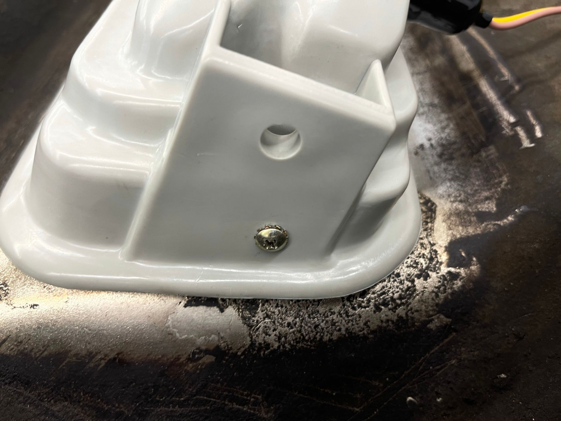 A close up of a white object with a hole in it