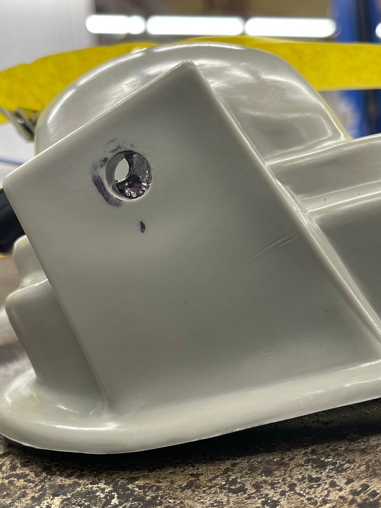 A white object with a hole in it is sitting on a table.