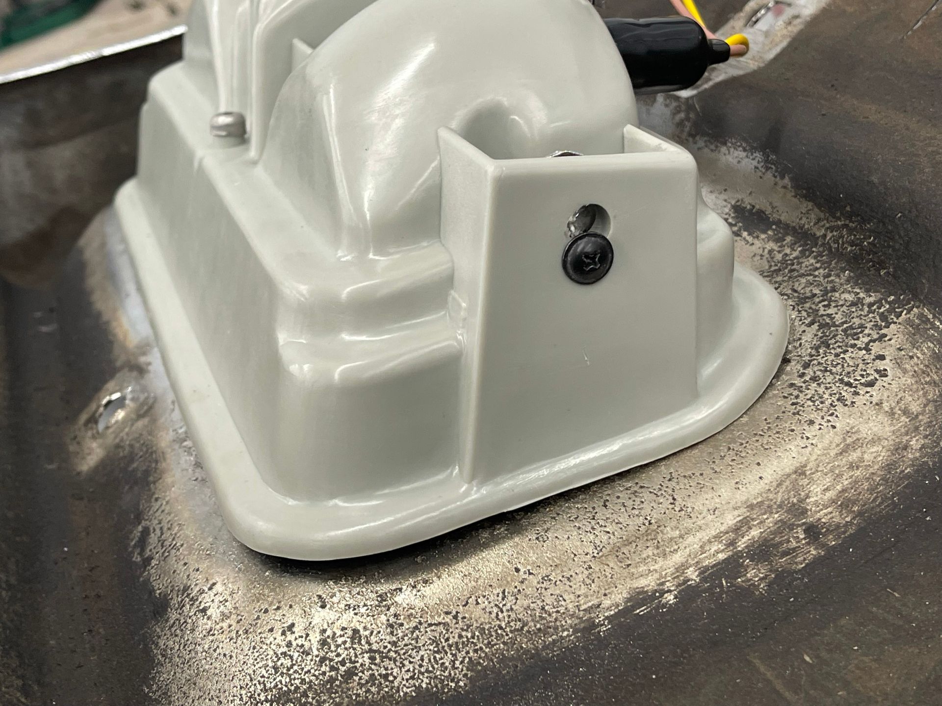 A white object is sitting on top of a metal surface.