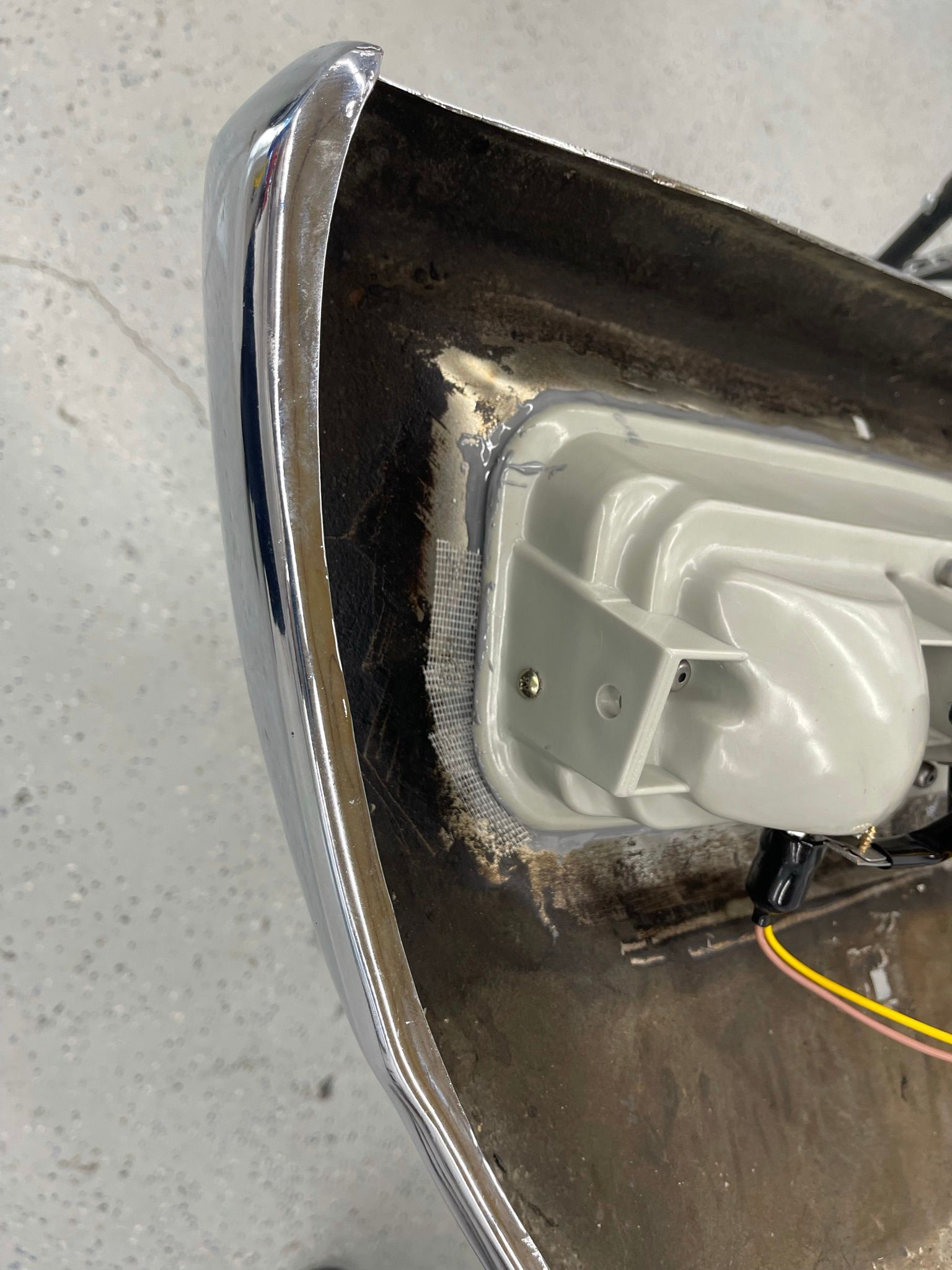 A close up of a bumper with a light on it.