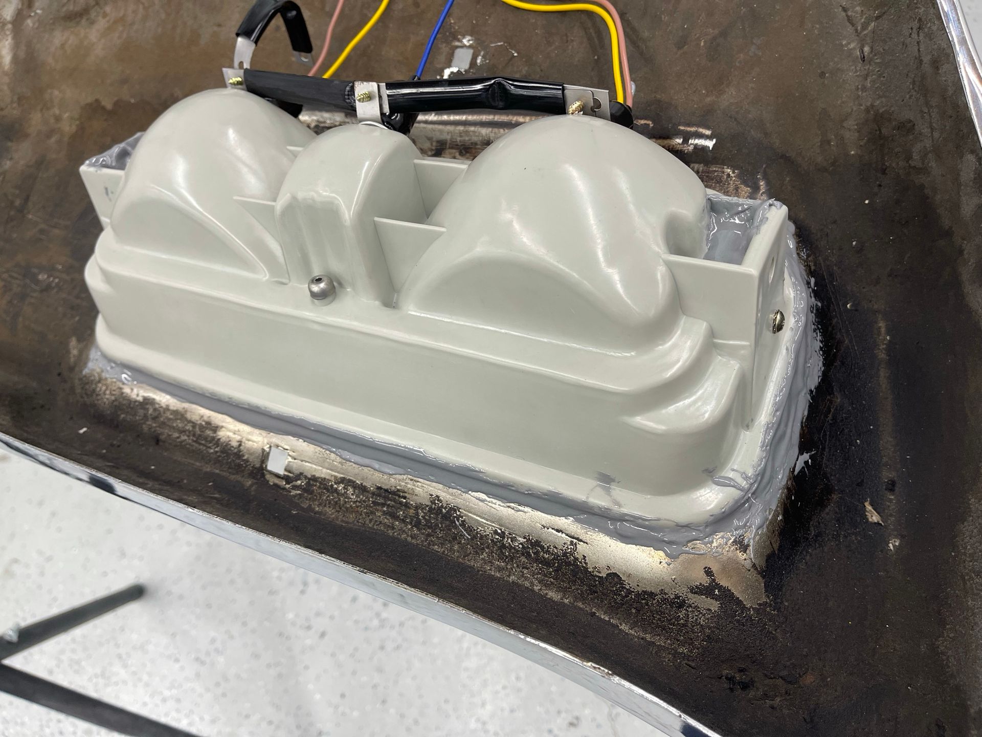 A close up of a white object with wires coming out of it