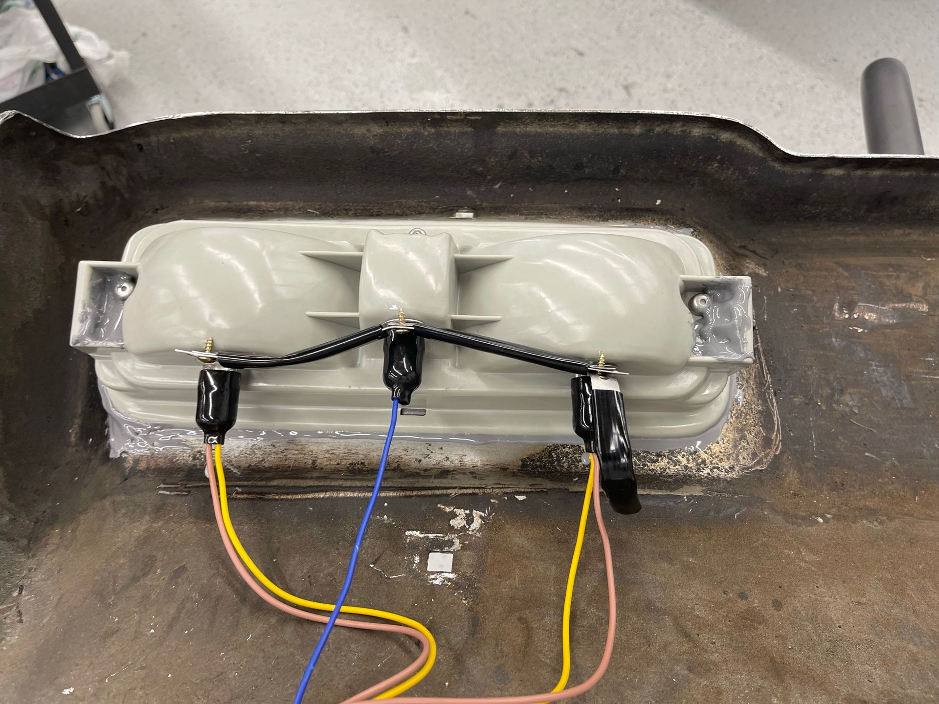A bunch of wires are connected to a car bumper