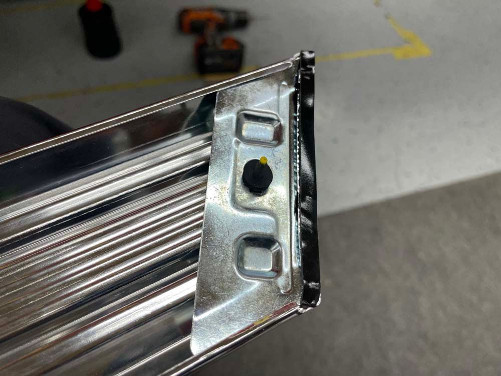 A close up of a metal object with a hole in it.