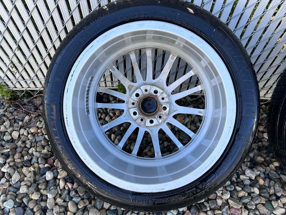 A close up of a car wheel with a tire on it.