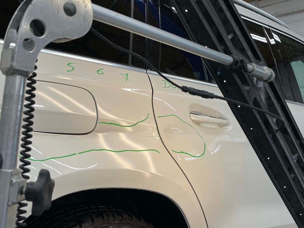 A close up of a car with a green line on it