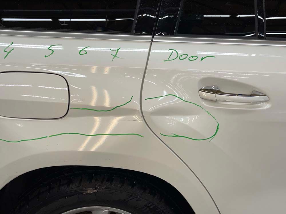 A white car with the word door written on it