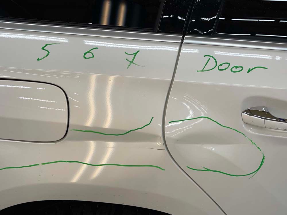 A white car with the word door written on it