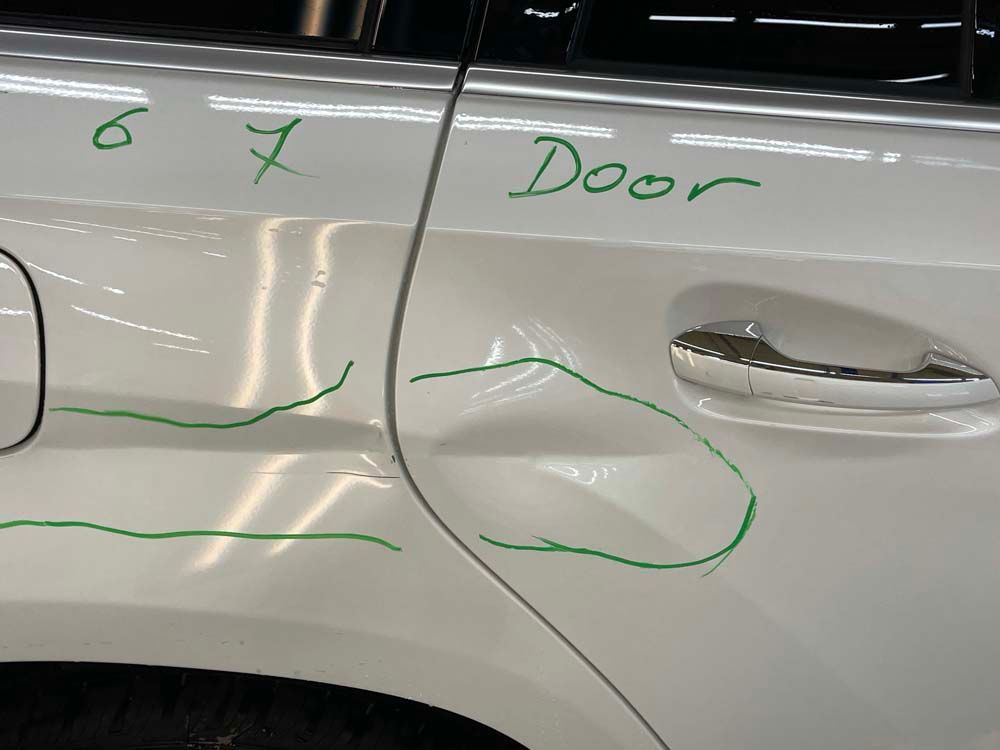 A white car with the word door written on it