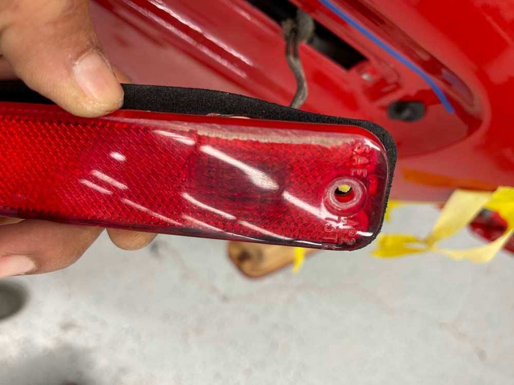 A person is holding a red light in their hand