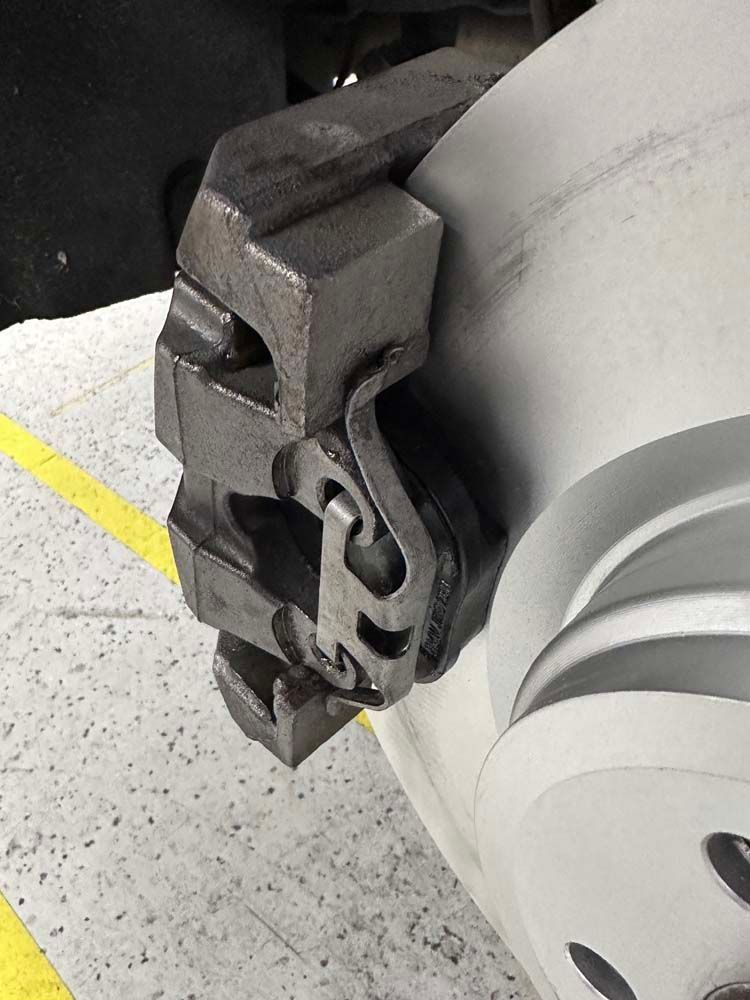 A close up of a brake caliper on a car