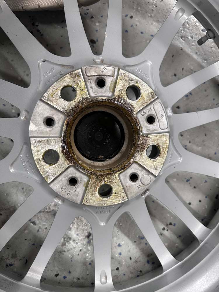 A close up of a wheel with holes in it.