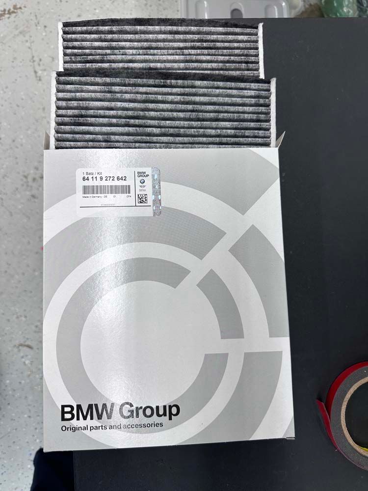 A box of bmw group air filter sitting on top of a table.