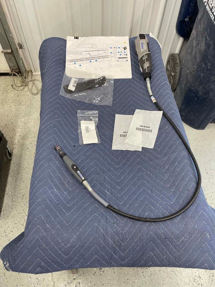 A cord is sitting on top of a blue blanket on a table.