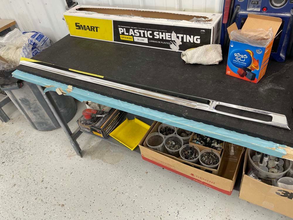 A box of plastic sheeting is sitting on top of a table.