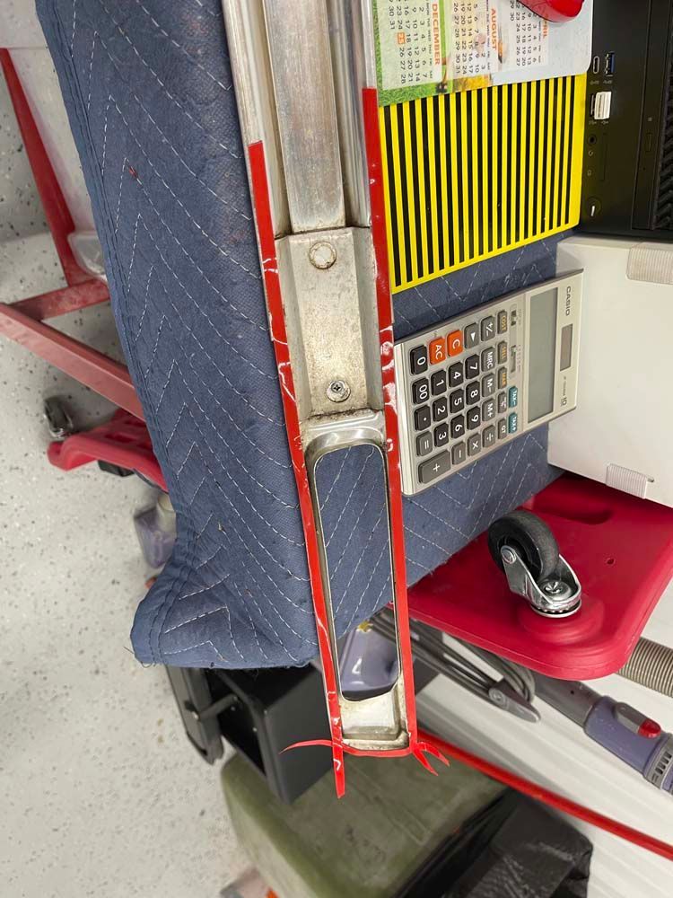 A calculator is sitting on top of a red cart