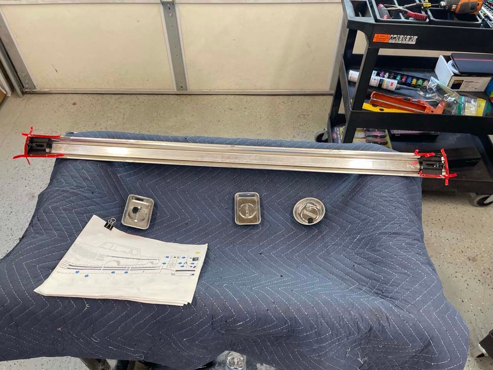 A piece of metal is sitting on a blue blanket on a table