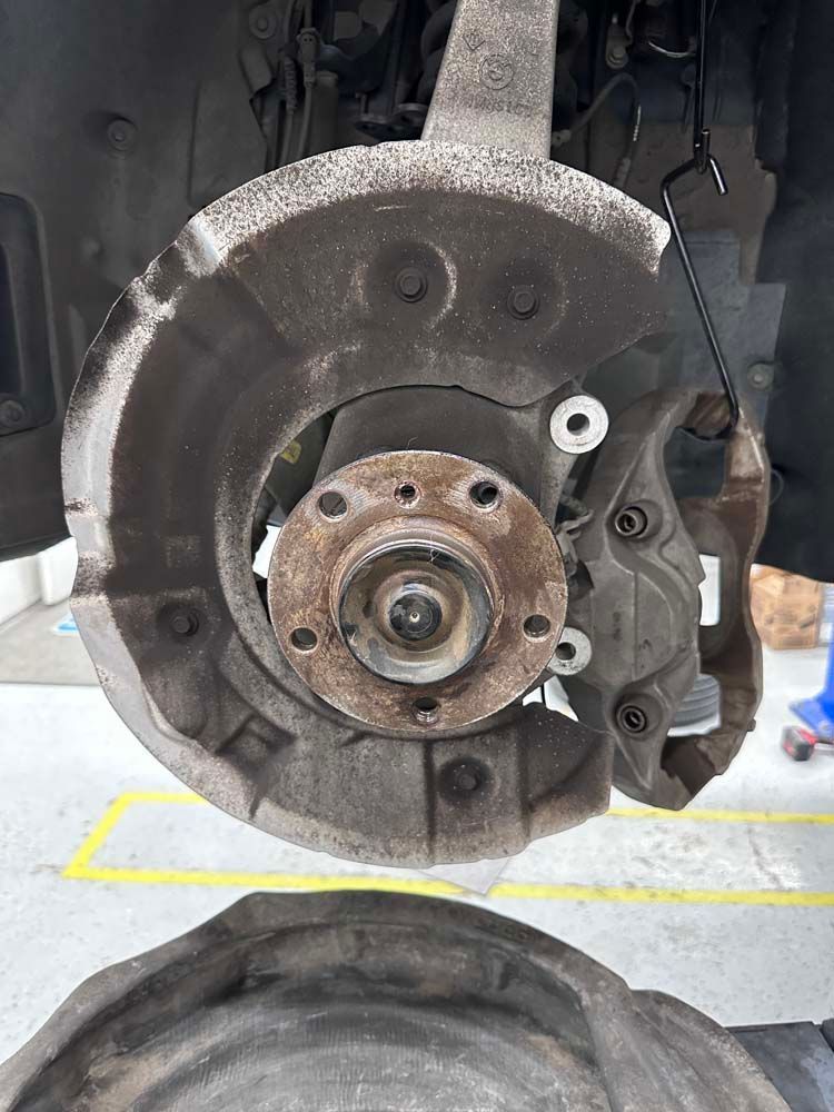 A close up of a brake disc on a car.