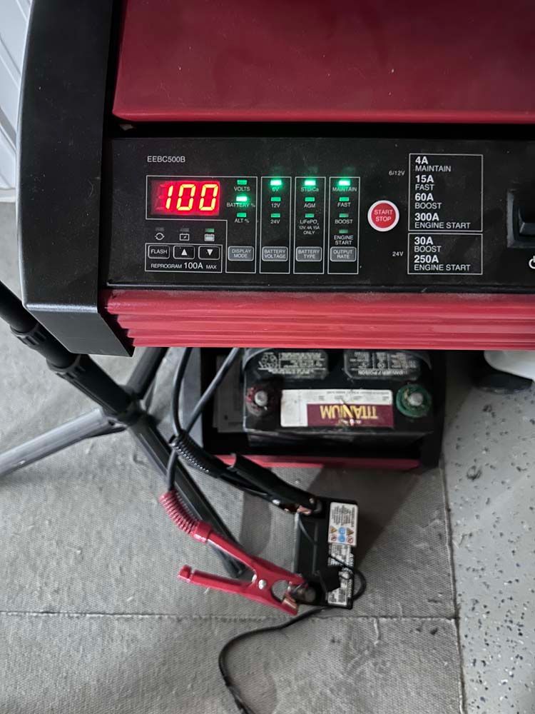 A titanium battery is being charged by a charger.