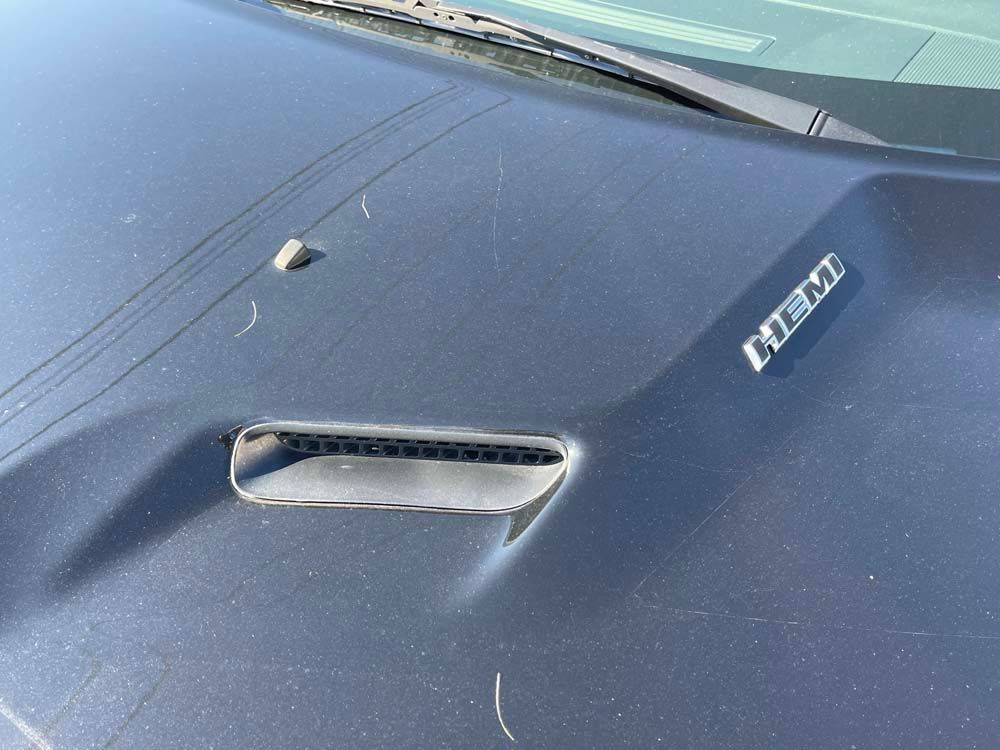 A close up of the hood of a dodge challenger