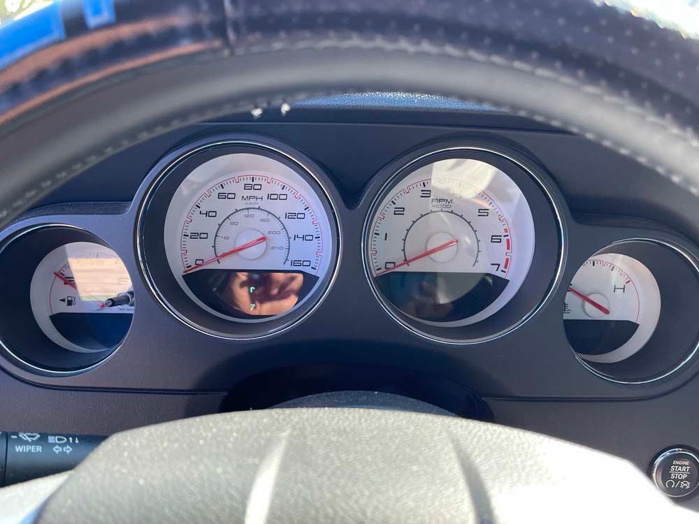 A close up of the dashboard of a dodge challenger