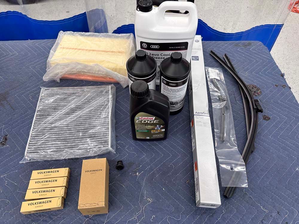 A table with a bottle of castrol oil on it