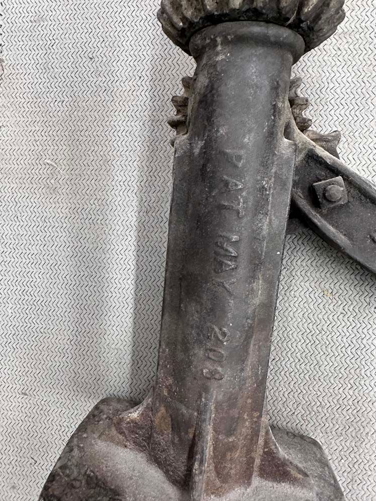 A close up of a metal object on a table.