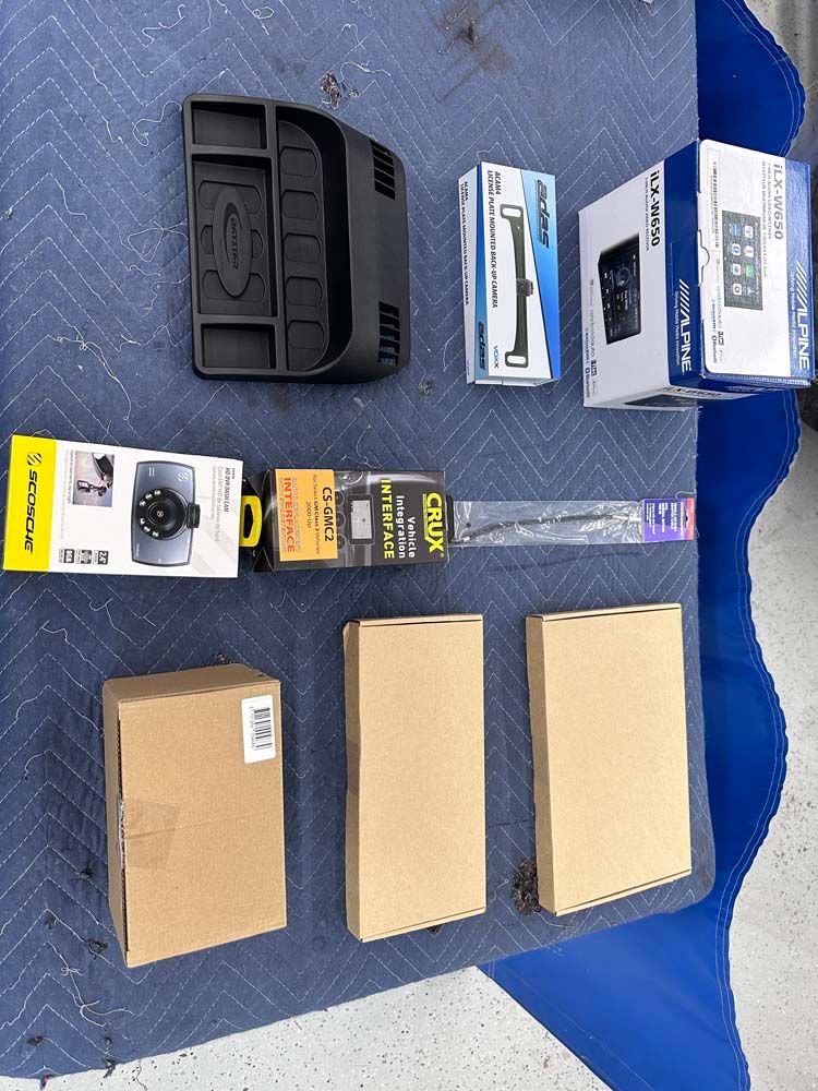 A bunch of boxes are sitting on top of a blue table.