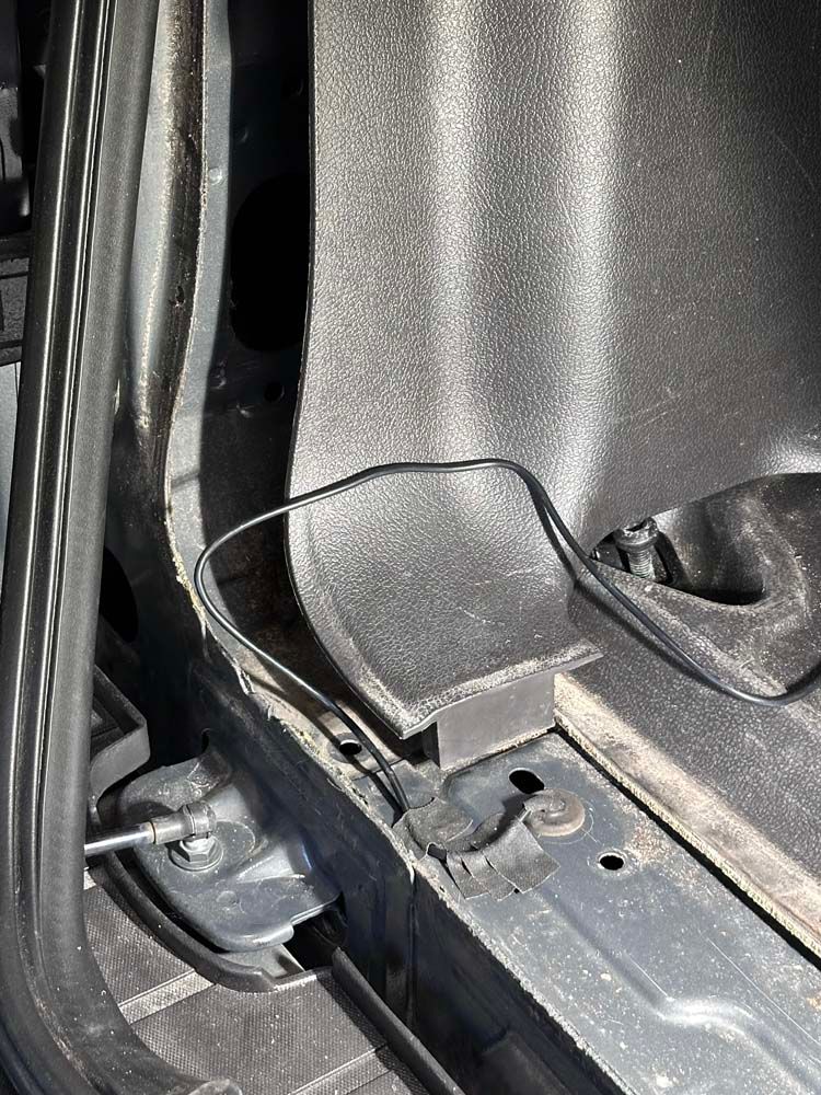 A close up of a metal object in a car.