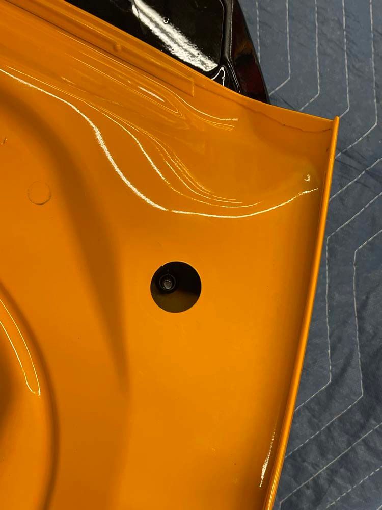 A close up of a yellow object with a hole in it